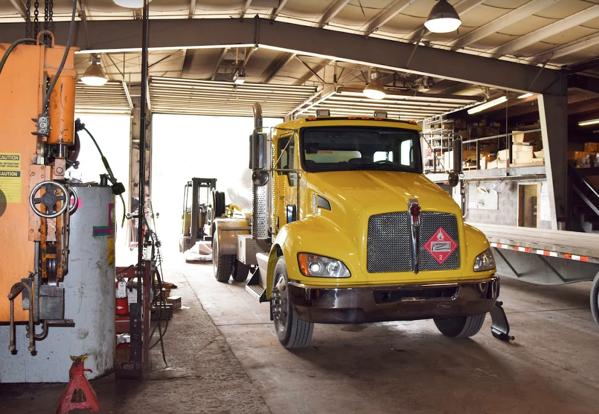 yellow mack truck in repair shop, williamsport, pa