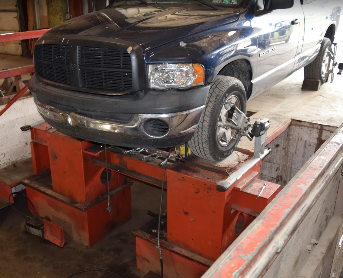blue heavy duty truck getting alignment services