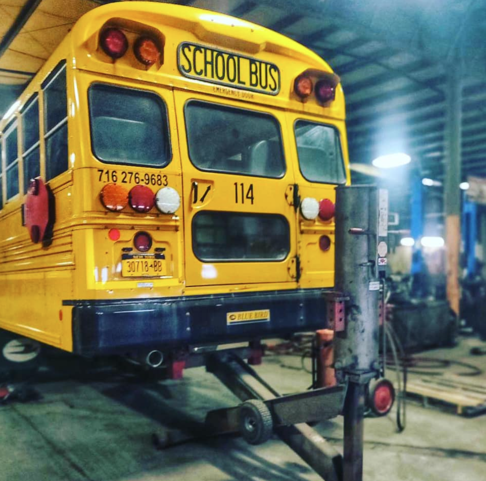 Yellow school bus getting repairs at taylors springs, brake and alignement