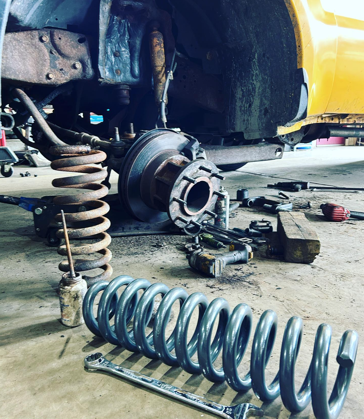 old and new spring coils for heavy duty suspension repair